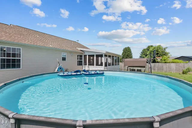 a view of a house with backyard porch and garden