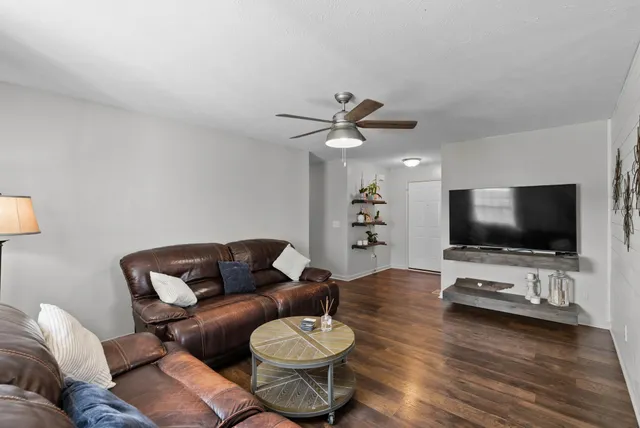 a living room with furniture and a flat screen tv