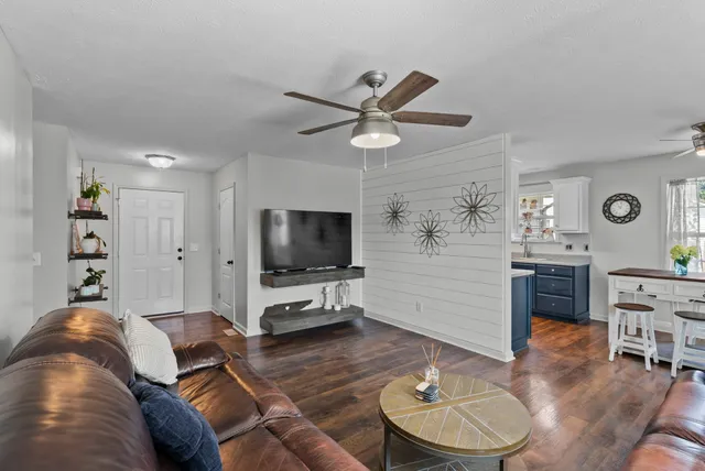 a kitchen with a table and chairs in it