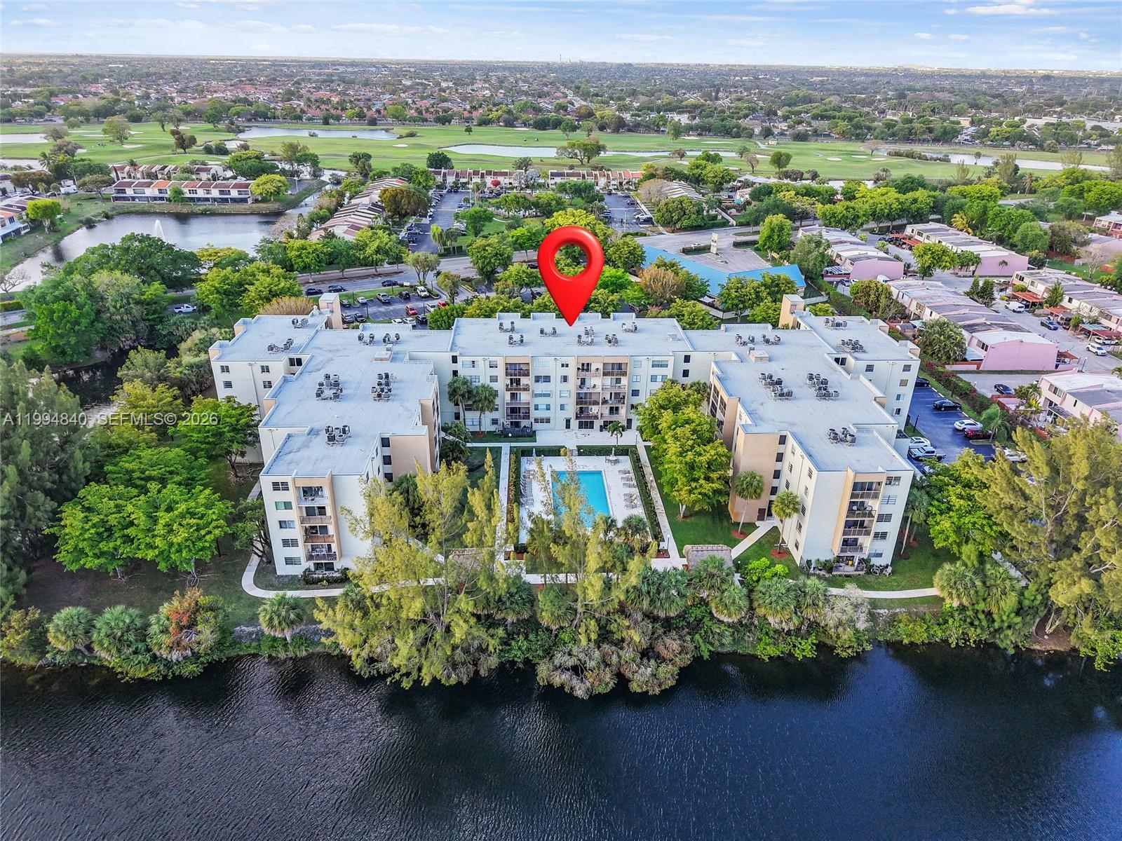 14250 Southwest 62nd Street, Unit 402 Miami, FL 33183 - Photo 1 of 25 an aerial view of multiple house