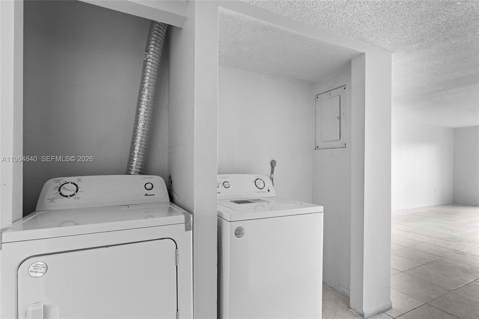 14250 Southwest 62nd Street, Unit 402 Miami, FL 33183 - Photo 12 of 25 a utility room with dryer and washer