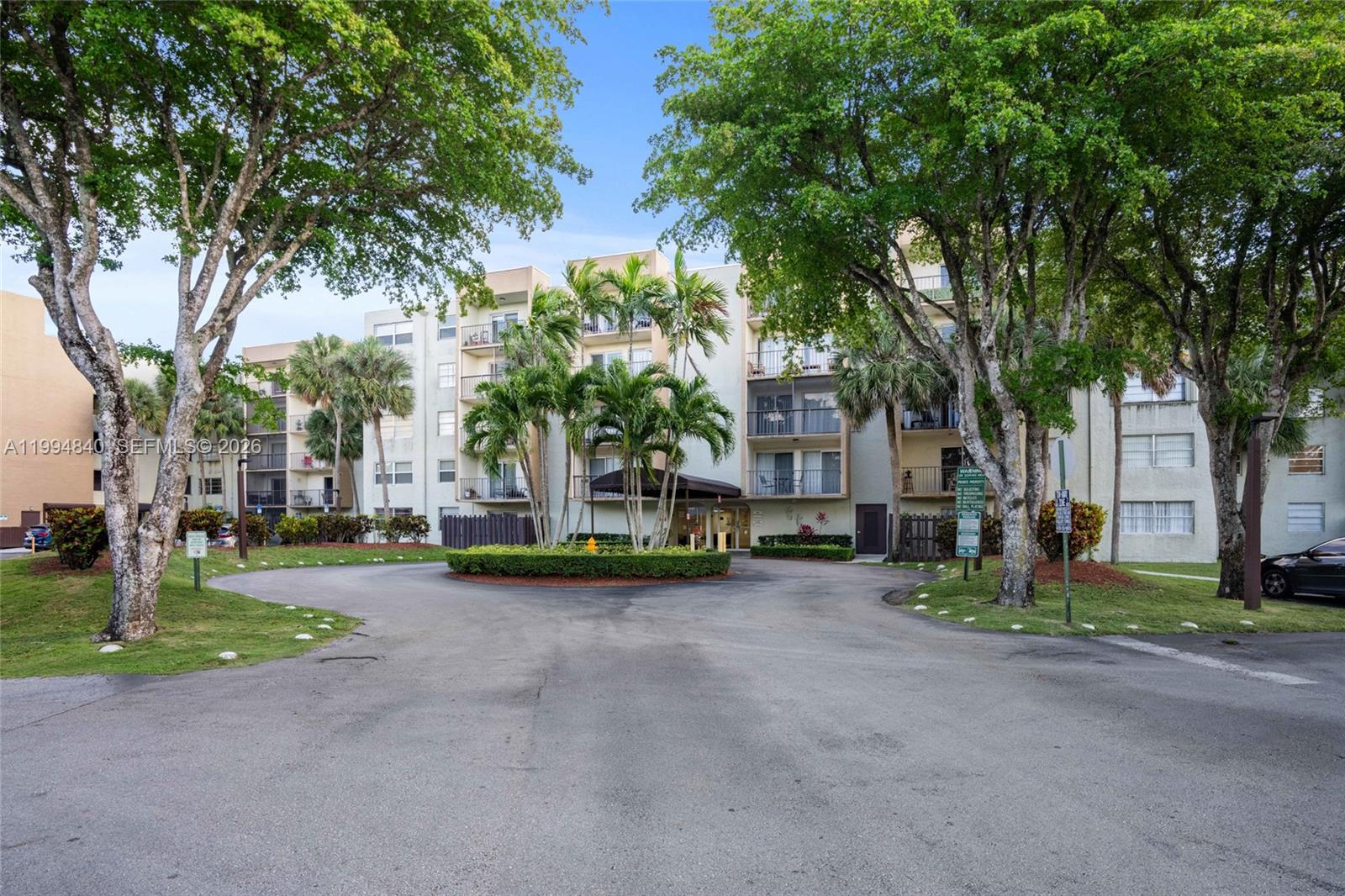 14250 Southwest 62nd Street, Unit 402 Miami, FL 33183 - Photo 3 of 25 a view of a park with plants and trees