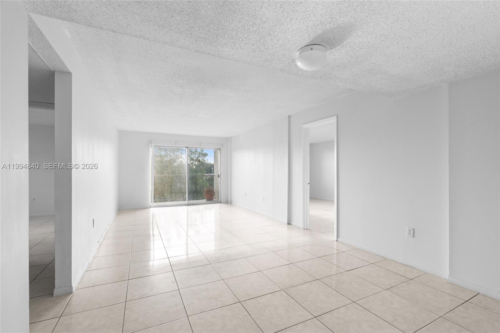 14250 Southwest 62nd Street, Unit 402 Miami, FL 33183 - Photo 6 of 25 a view of an empty room and window