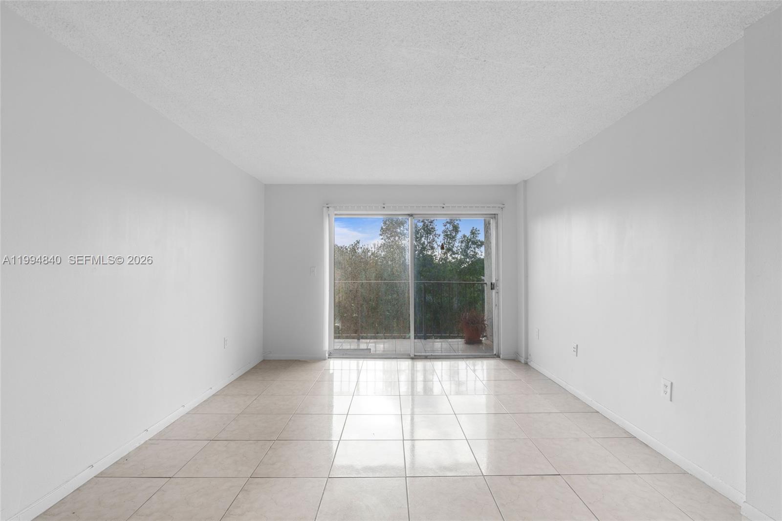14250 Southwest 62nd Street, Unit 402 Miami, FL 33183 - Photo 8 of 25 a view of an empty room with window