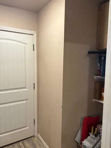 a kitchen with a refrigerator and a stove top oven