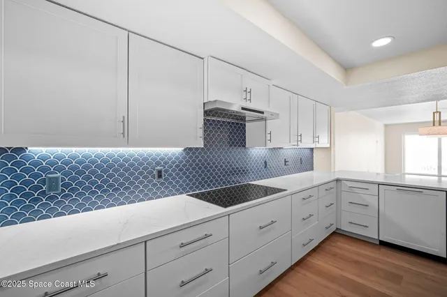 a kitchen with sink and window