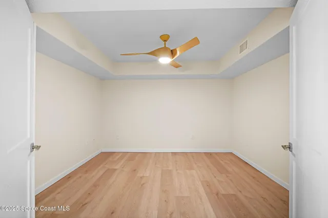 a view of kitchen and empty room