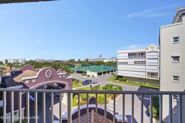 a view of a balcony with city view