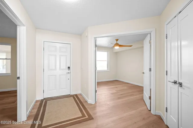 a kitchen with stainless steel appliances granite countertop a large counter top a stove and a refrigerator