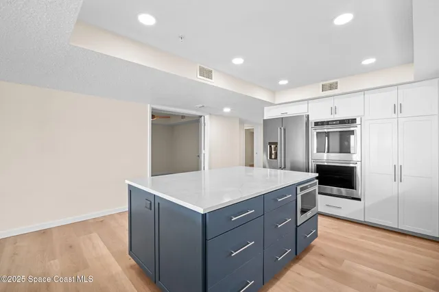a kitchen with cabinets and sink