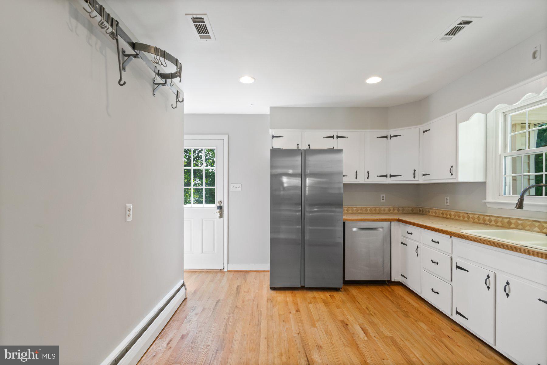4945 Montgomery Road Ellicott City, MD 21043 - Photo 12 of 37 Updated kitchen with brand new fridge