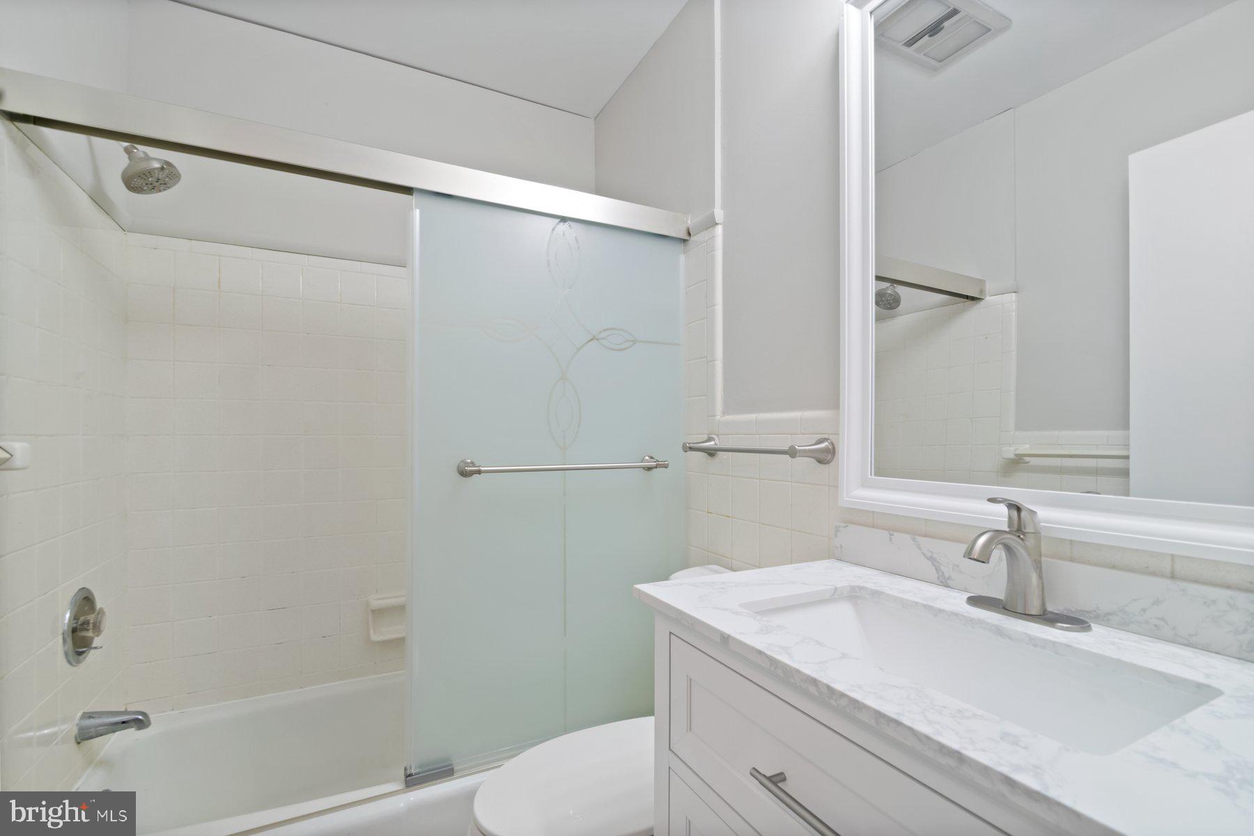 4945 Montgomery Road Ellicott City, MD 21043 - Photo 19 of 37 Hall bath with brand new vanity & mirror
