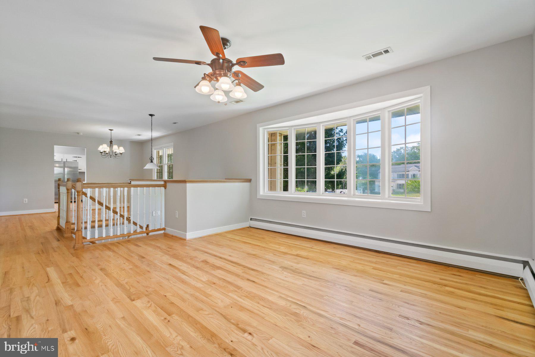 4945 Montgomery Road Ellicott City, MD 21043 - Photo 6 of 37 Living room with refinished wood floors