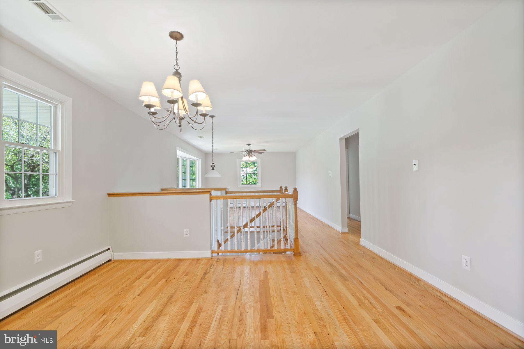 4945 Montgomery Road Ellicott City, MD 21043 - Photo 7 of 37 Dining room with refinished wood floors
