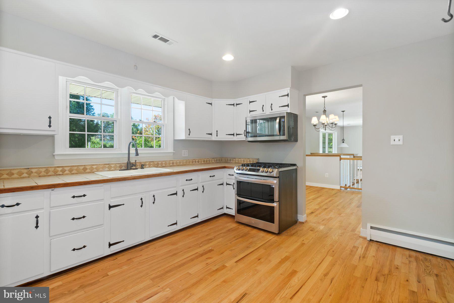 4945 Montgomery Road Ellicott City, MD 21043 - Photo 9 of 37 Updated kitchen with refinished floors