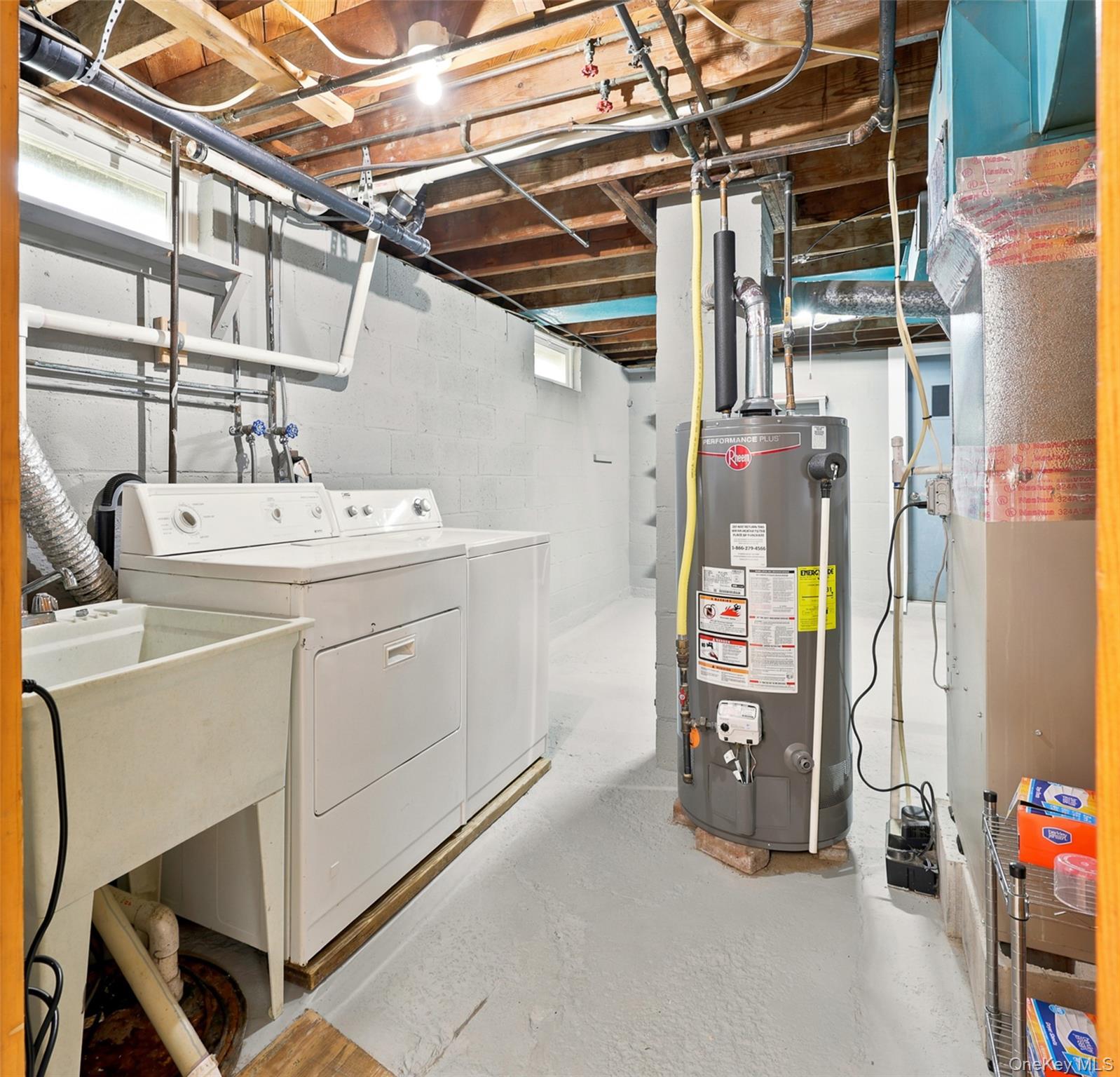48 Ryerson Road New Hampton, NY 10958 - Photo 23 of 33 Laundry washer, dryer, and sink in an unfinished basement