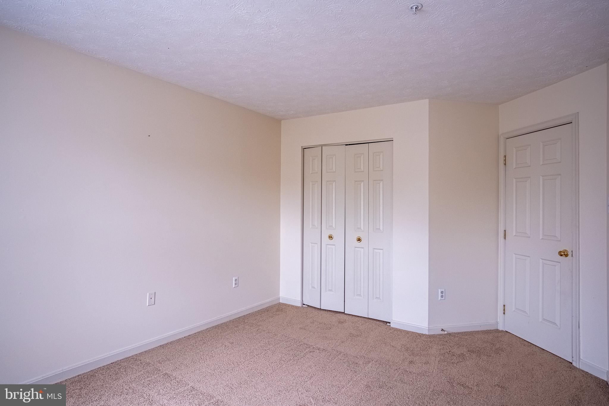 4910 Edgeware Terrace Frederick, MD 21703 - Photo 17 of 34 a view of an empty room