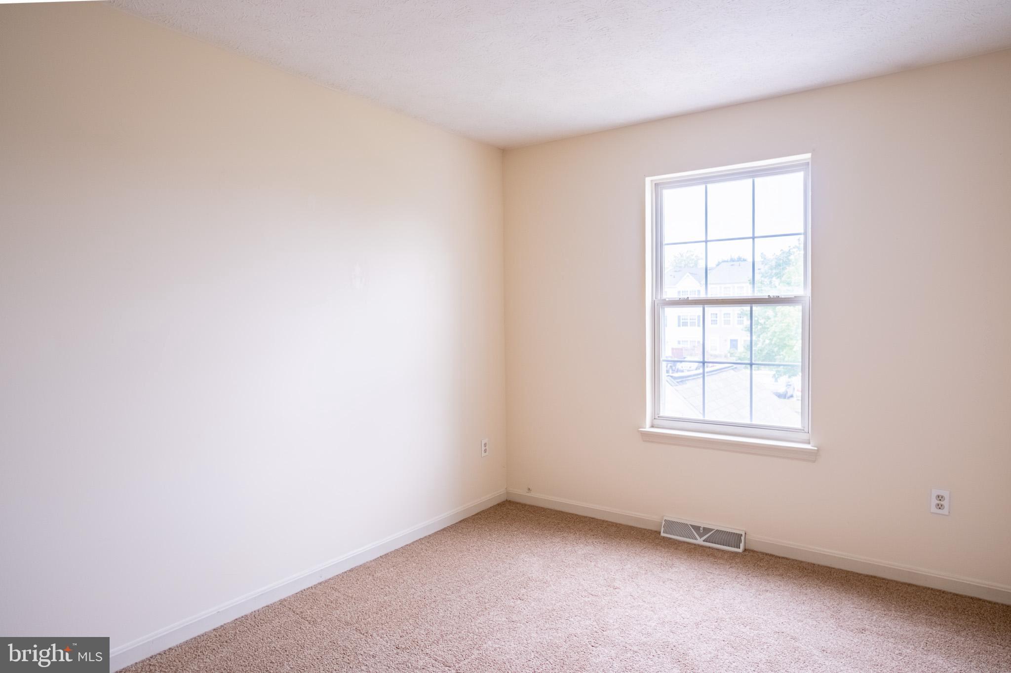 4910 Edgeware Terrace Frederick, MD 21703 - Photo 19 of 34 an empty room with a window