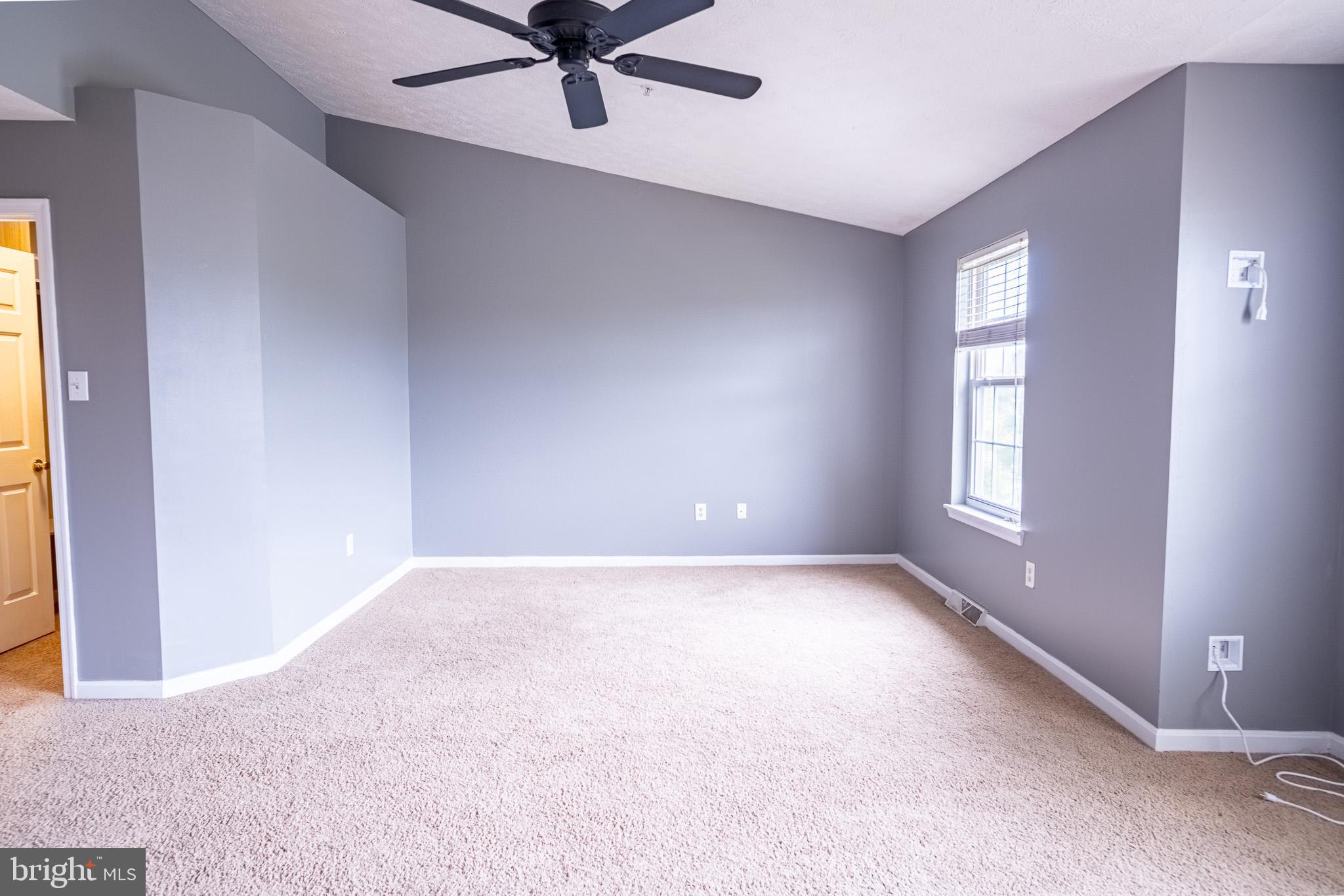 4910 Edgeware Terrace Frederick, MD 21703 - Photo 26 of 34 a view of an empty room with a window