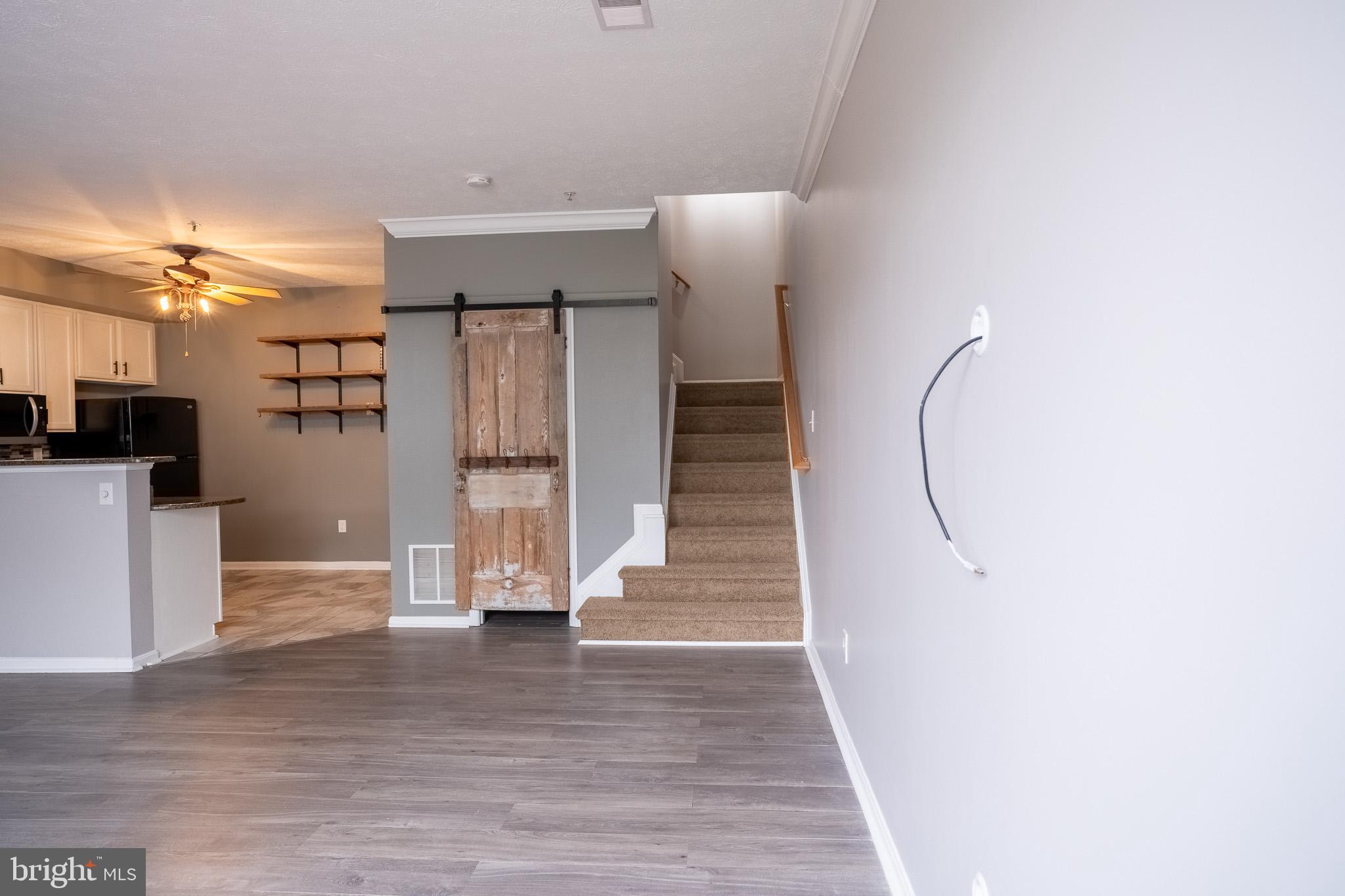 4910 Edgeware Terrace Frederick, MD 21703 - Photo 3 of 34 a view of entryway with wooden floor