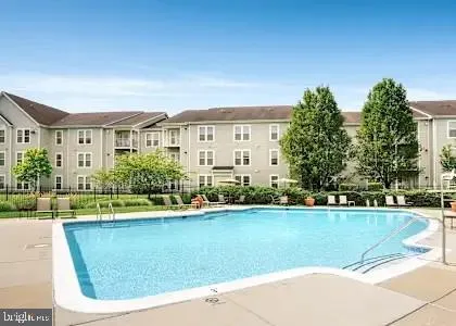 a view of a house with a swimming pool