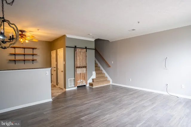 a view of a livingroom with wooden floor