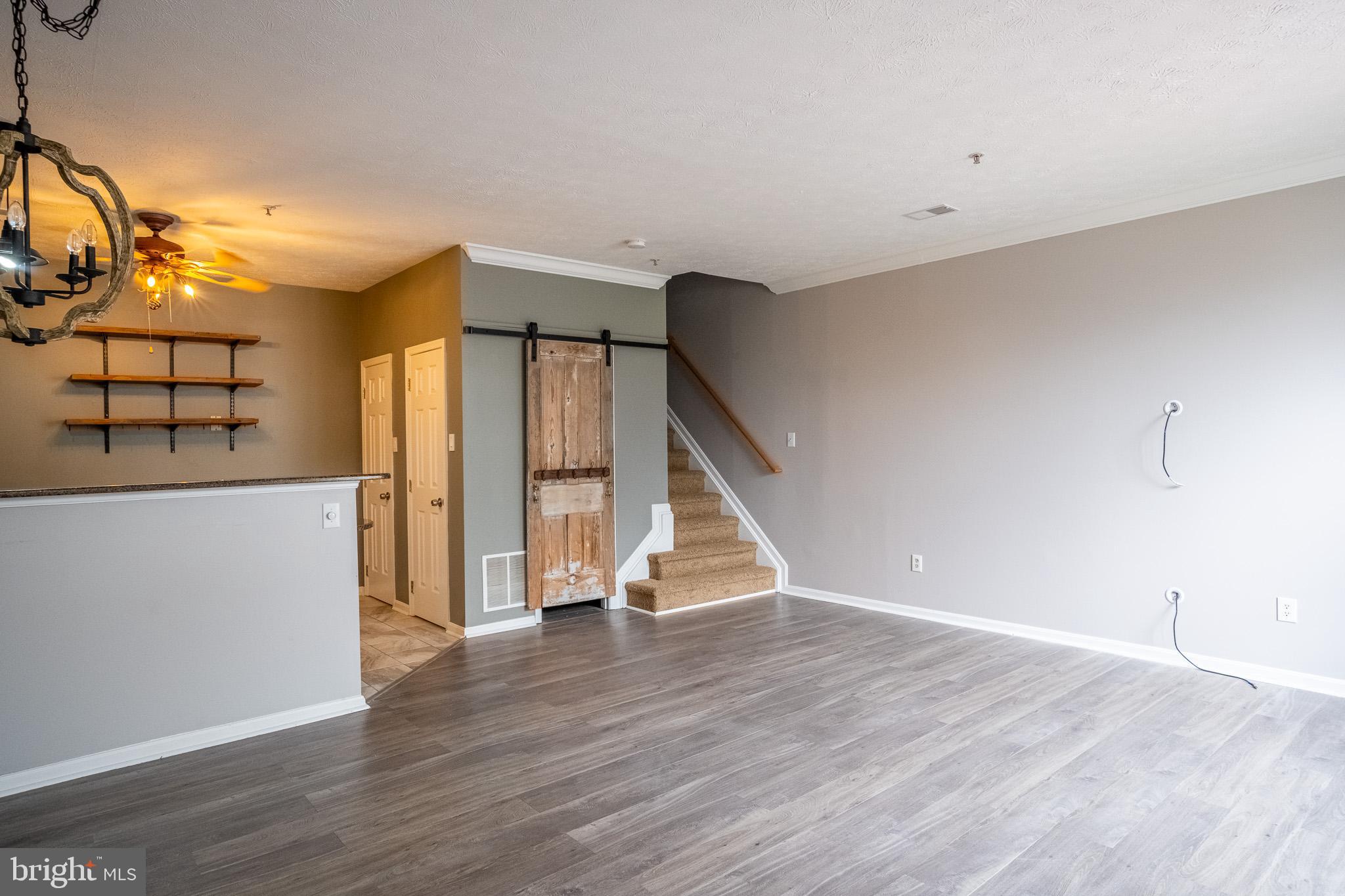 4910 Edgeware Terrace Frederick, MD 21703 - Photo 5 of 34 a view of a livingroom with wooden floor