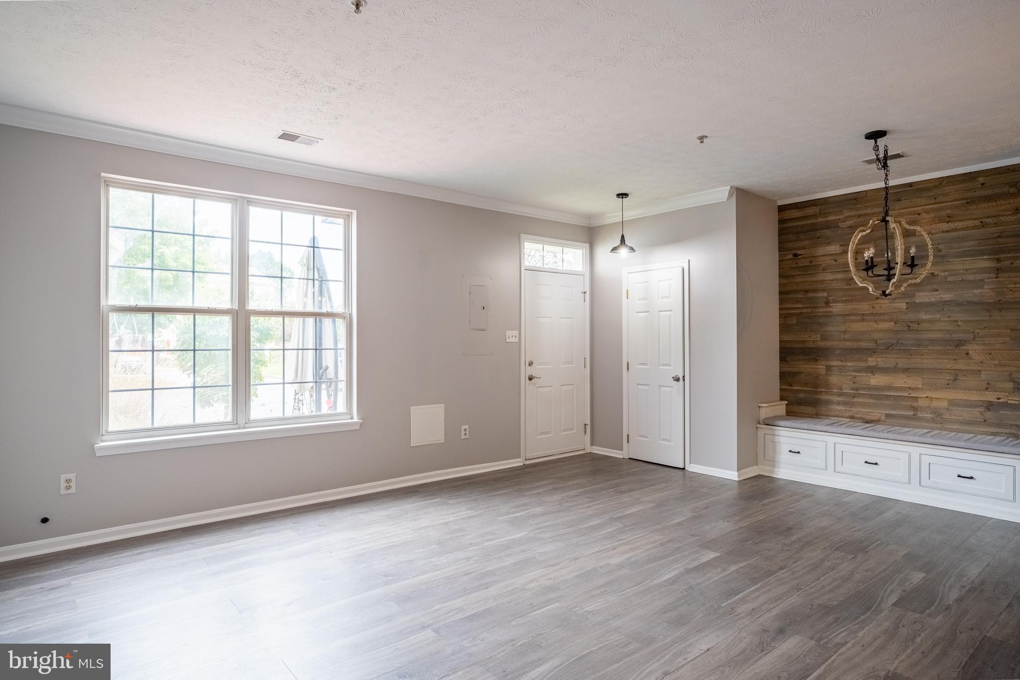 4910 Edgeware Terrace Frederick, MD 21703 - Photo 6 of 34 a view of an empty room with a window