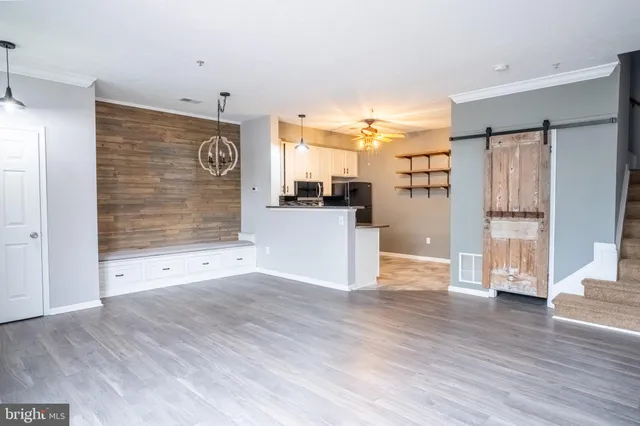 a view of a kitchen with wooden floor