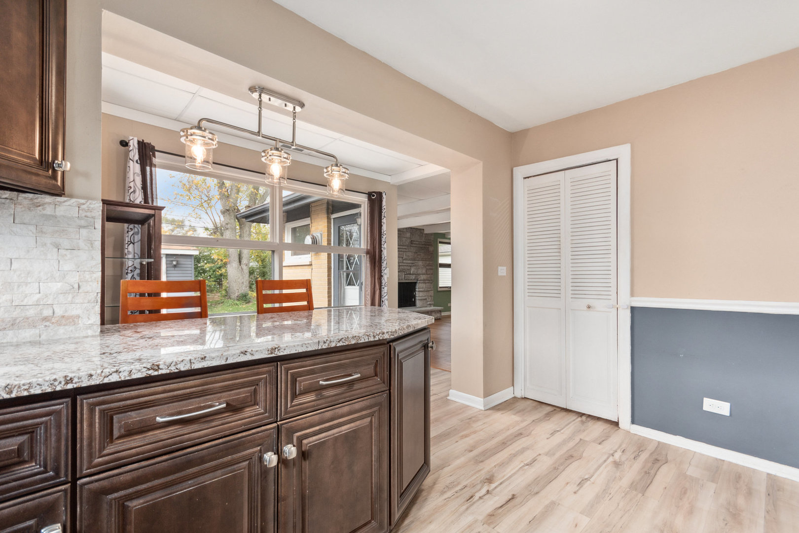 38 Highview Avenue Addison, IL 60101 - Photo 7 of 17 a kitchen with granite countertop stainless steel appliances a sink and cabinets