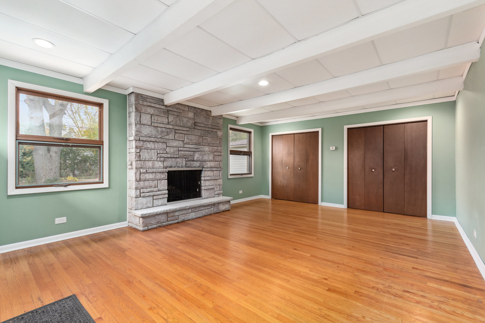 38 Highview Avenue Addison, IL 60101 - Photo 8 of 17 a view of an empty room with window and wooden floor