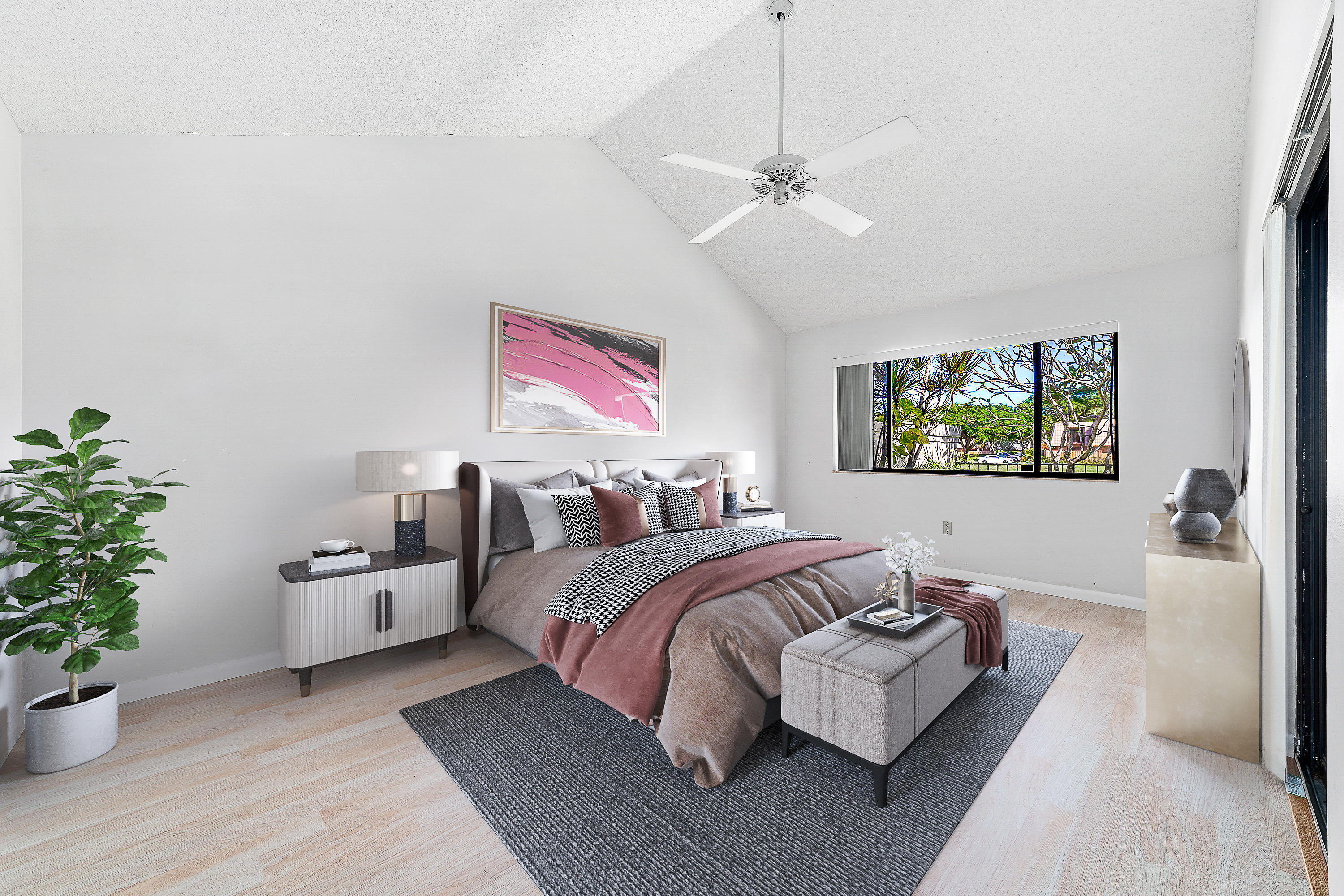 2630 Mohawk Circle West Palm Beach, FL 33409 - Photo 18 of 39 a spacious bedroom with a bed and a potted plant