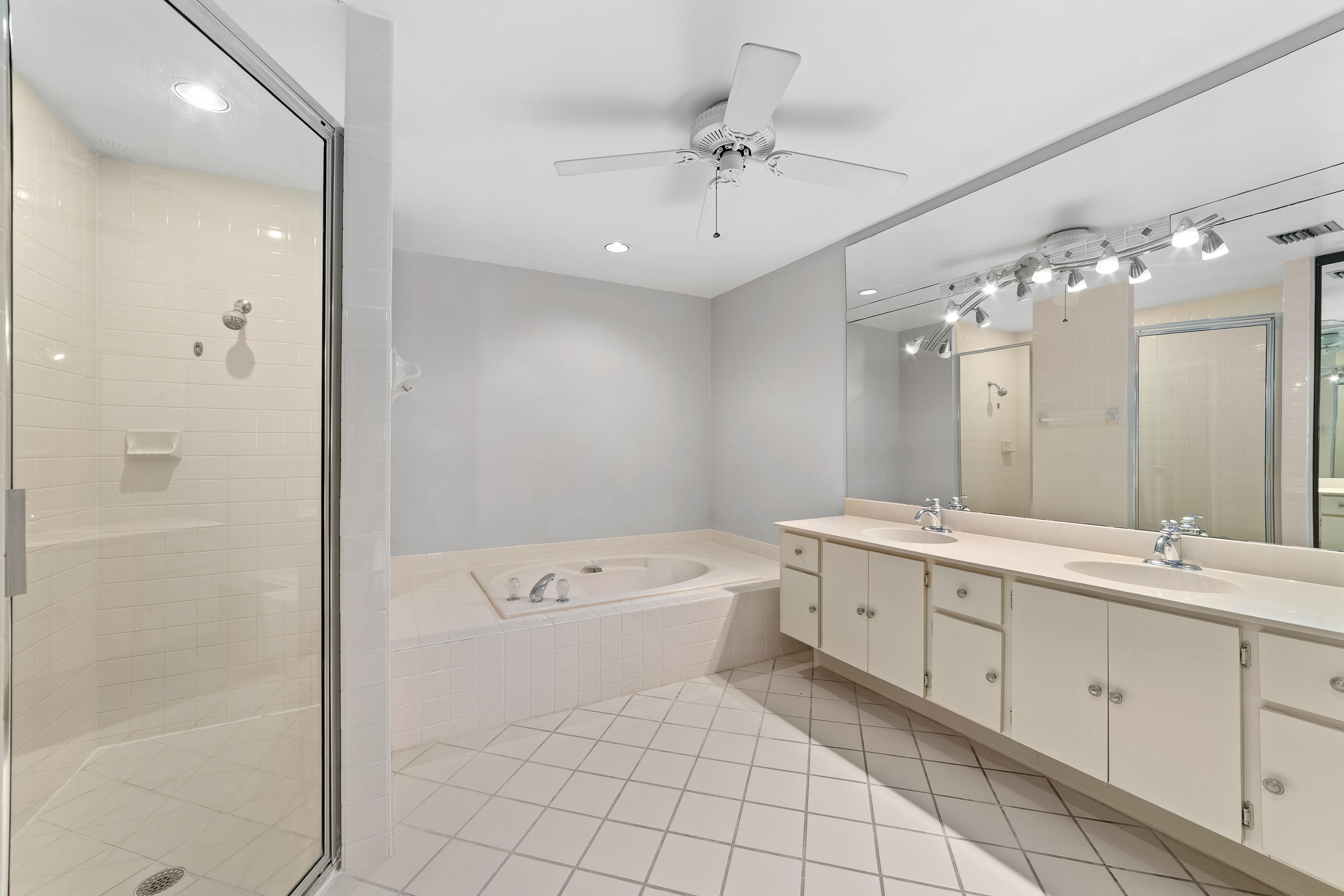 2630 Mohawk Circle West Palm Beach, FL 33409 - Photo 23 of 39 a spacious bathroom with a double vanity sink mirror and bathtub