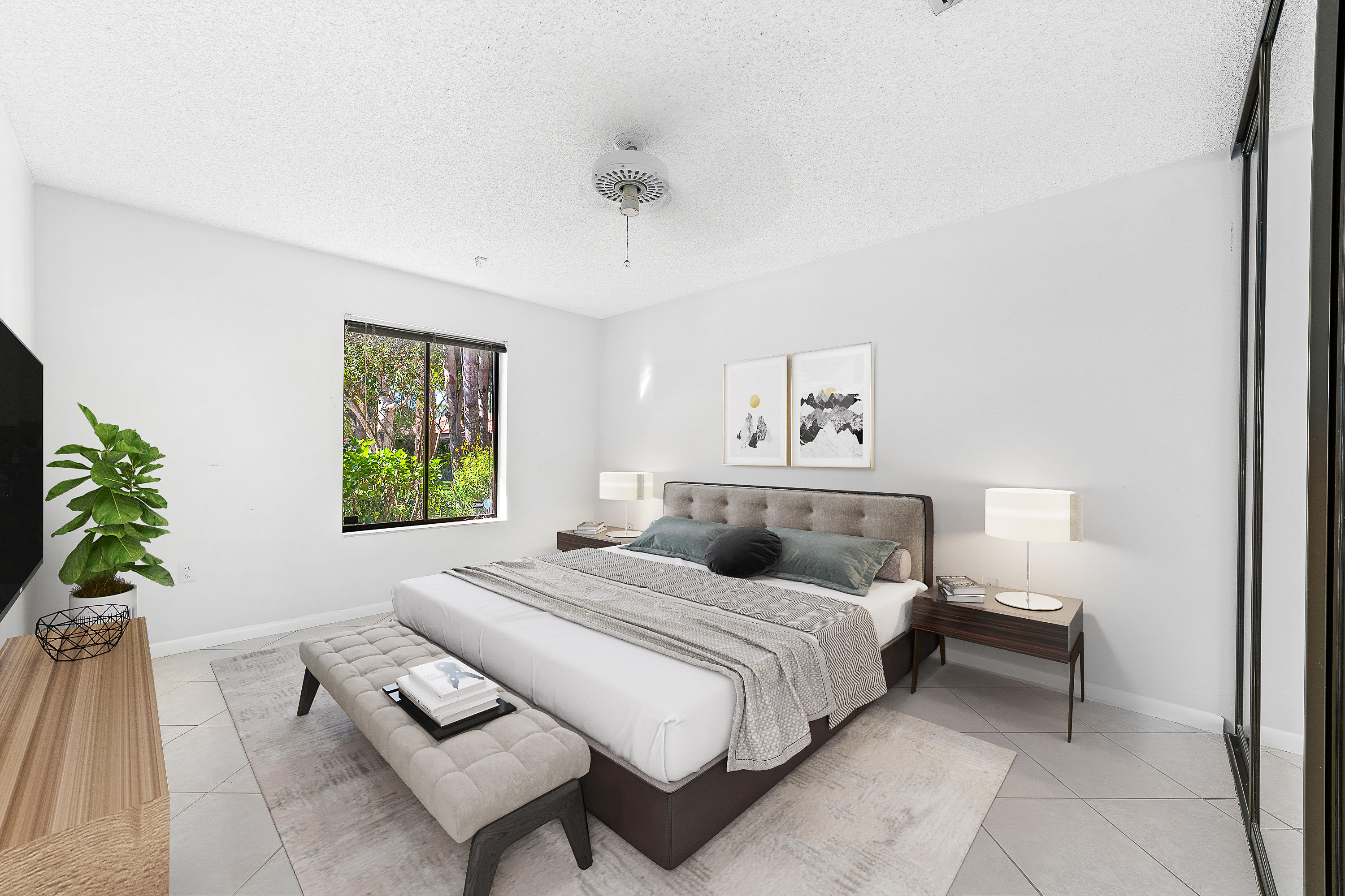 2630 Mohawk Circle West Palm Beach, FL 33409 - Photo 31 of 39 a bedroom with a bed and a couch