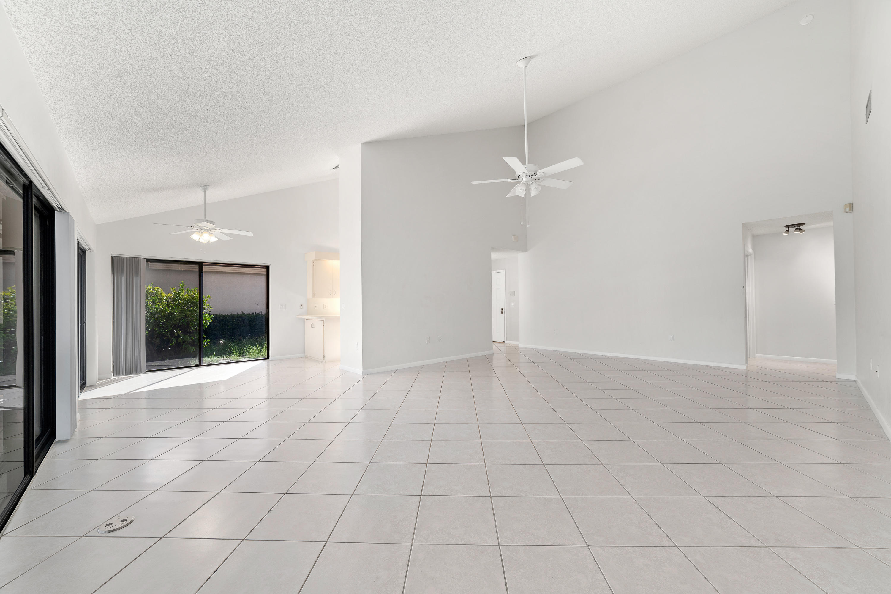 2630 Mohawk Circle West Palm Beach, FL 33409 - Photo 9 of 39 a view of an empty room with glass door