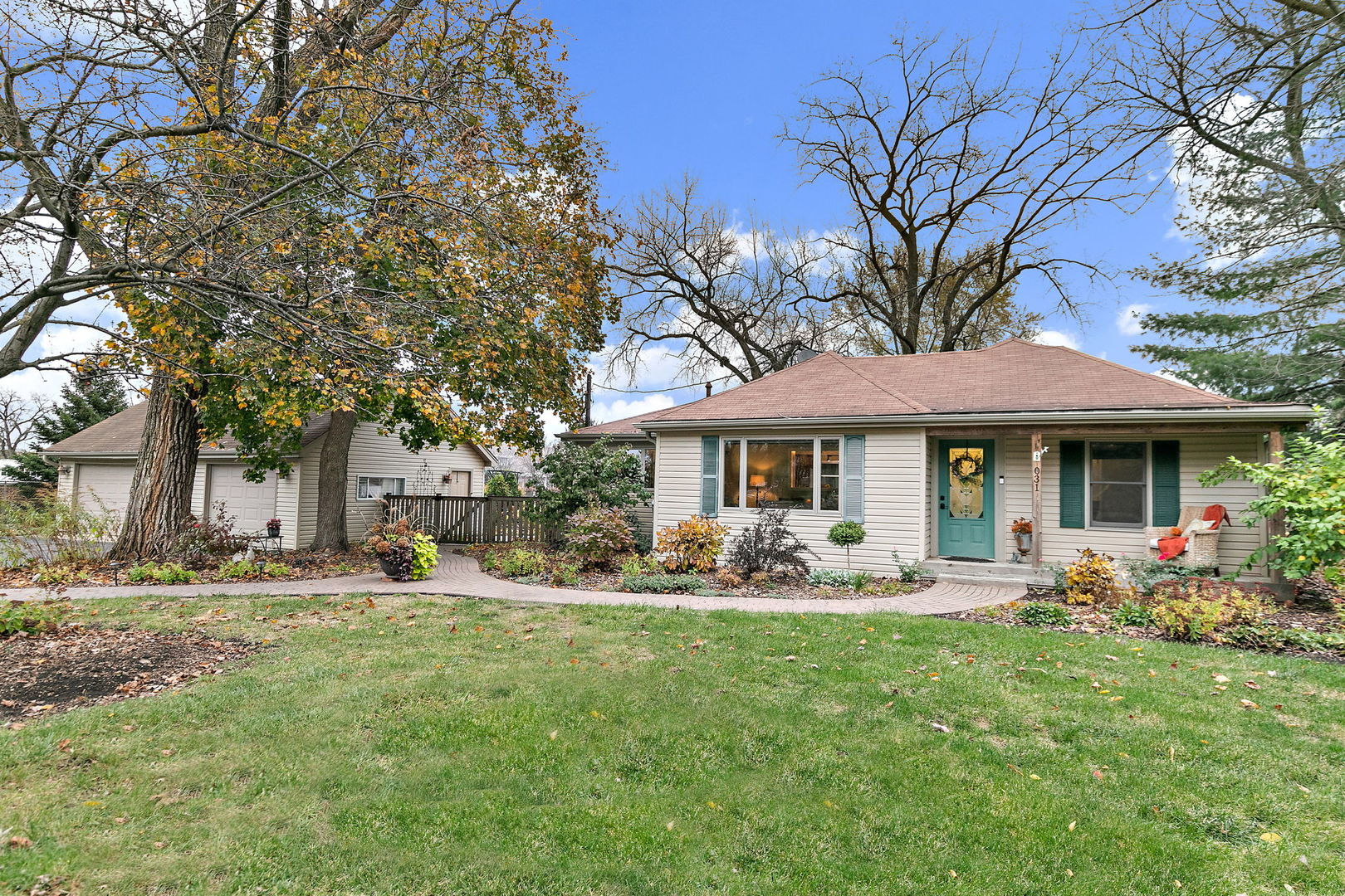 S031 Pearl Road West Chicago, IL 60185 - Photo 1 of 39 a front view of a house with garden and trees
