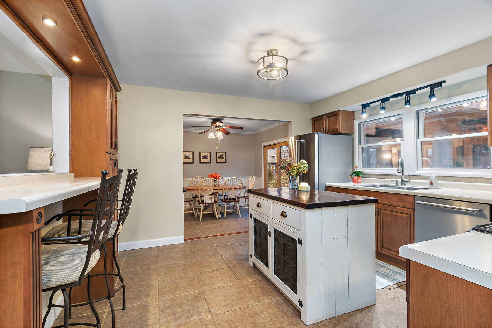 S031 Pearl Road West Chicago, IL 60185 - Photo 7 of 39 a kitchen with stainless steel appliances granite countertop a stove and chairs