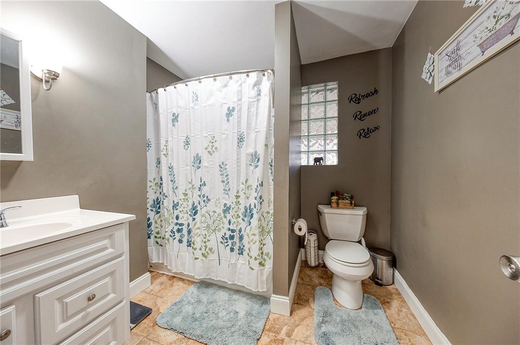 9424 Saltsburg Road Pittsburgh, PA 15239 - Photo 12 of 29 Large main bathroom on the main level with tub with fiberglass surround and linen closet