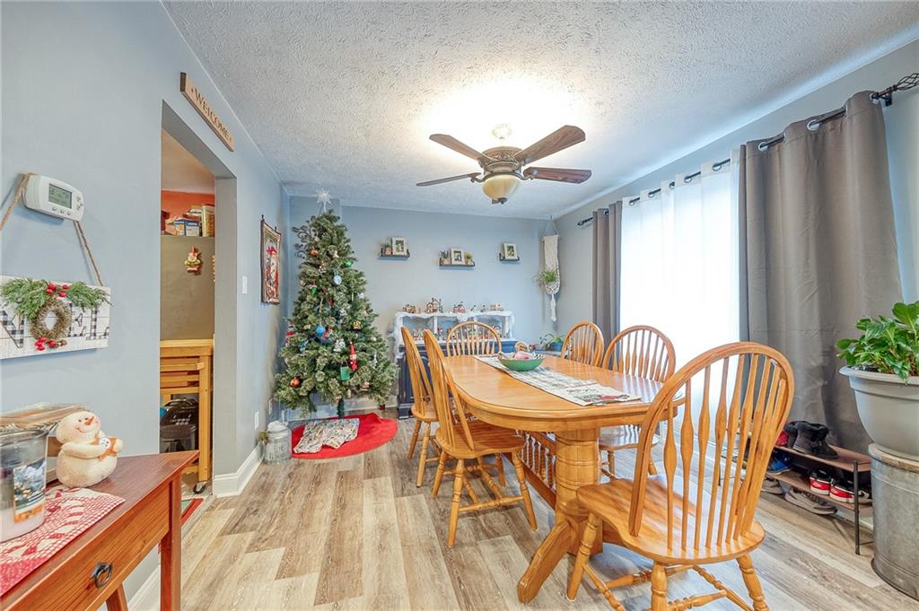 9424 Saltsburg Road Pittsburgh, PA 15239 - Photo 5 of 29 Spacious dining room with large picture window, allowing natural light to flood the room