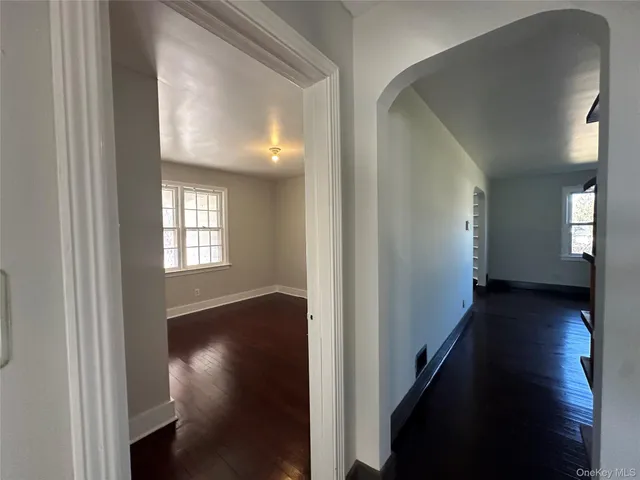 a bathroom with a granite countertop sink mirror and toilet