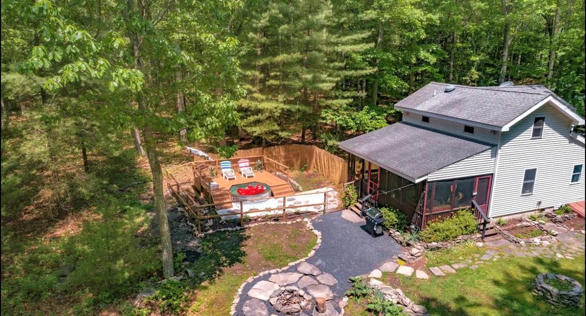 an aerial view of a house with a yard
