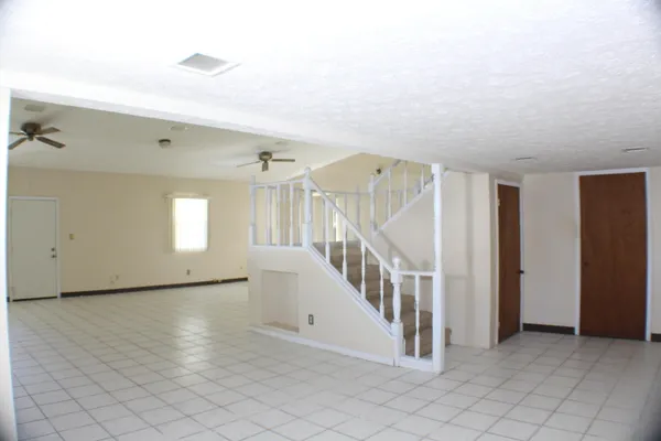 a view of entryway with stairs and wooden floor