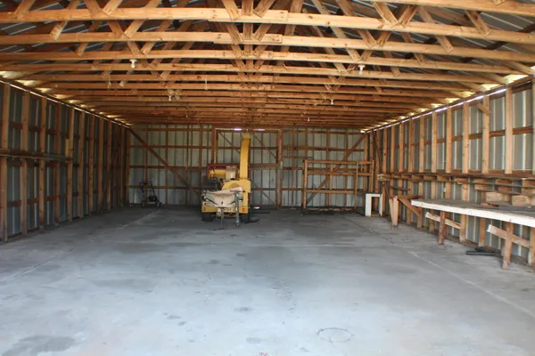 a view of a garage with wooden walls