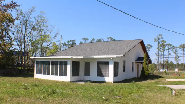 a view of front a house with a yard