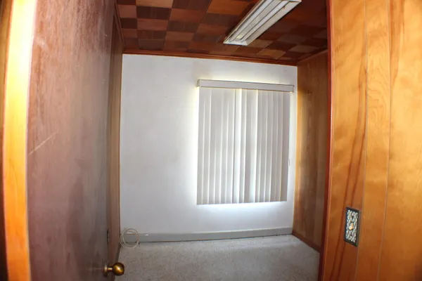 a view of an empty room with a window