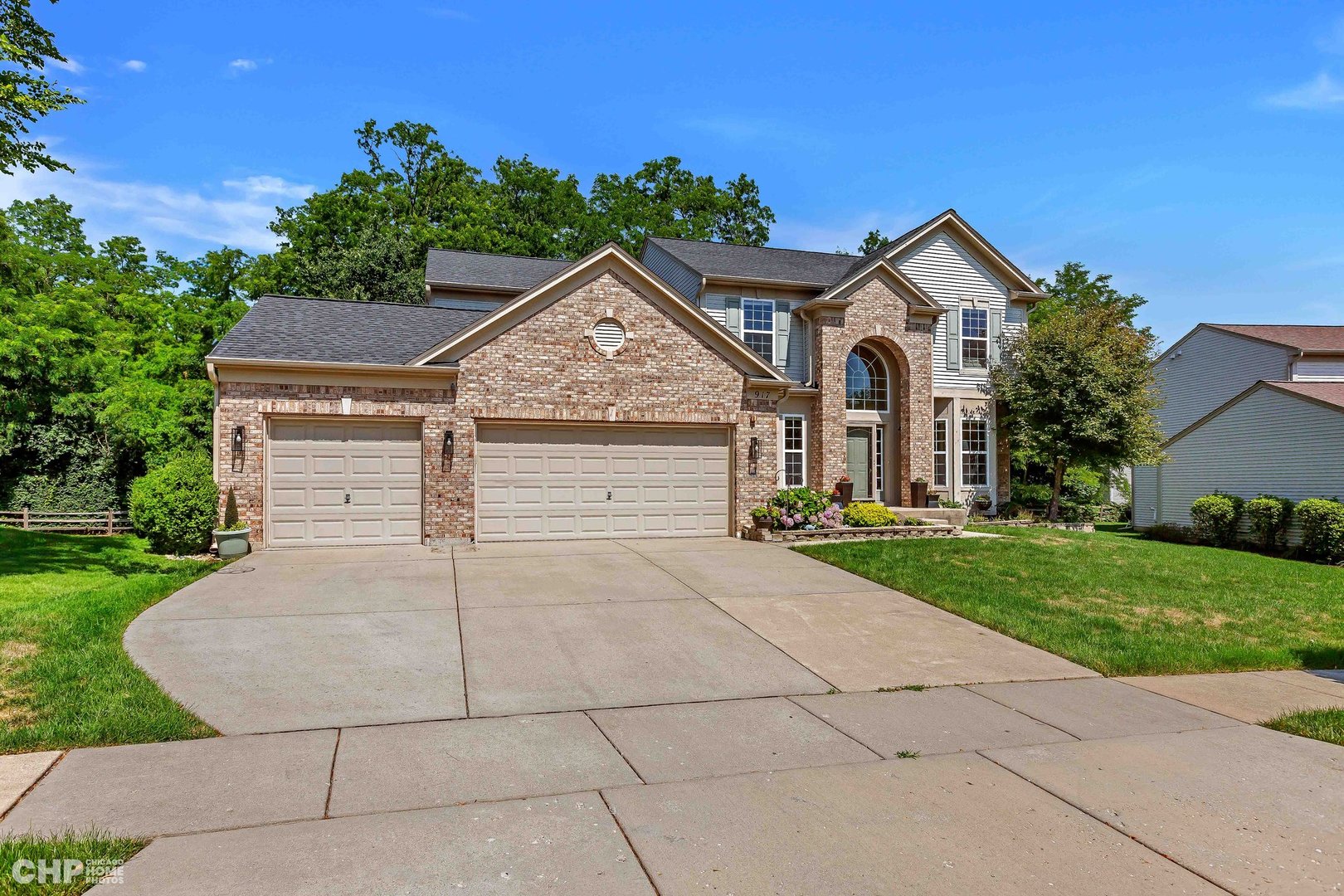 917 Blue Ridge Drive Streamwood, IL 60107 - Photo 1 of 46 a front view of a house with a yard and garage