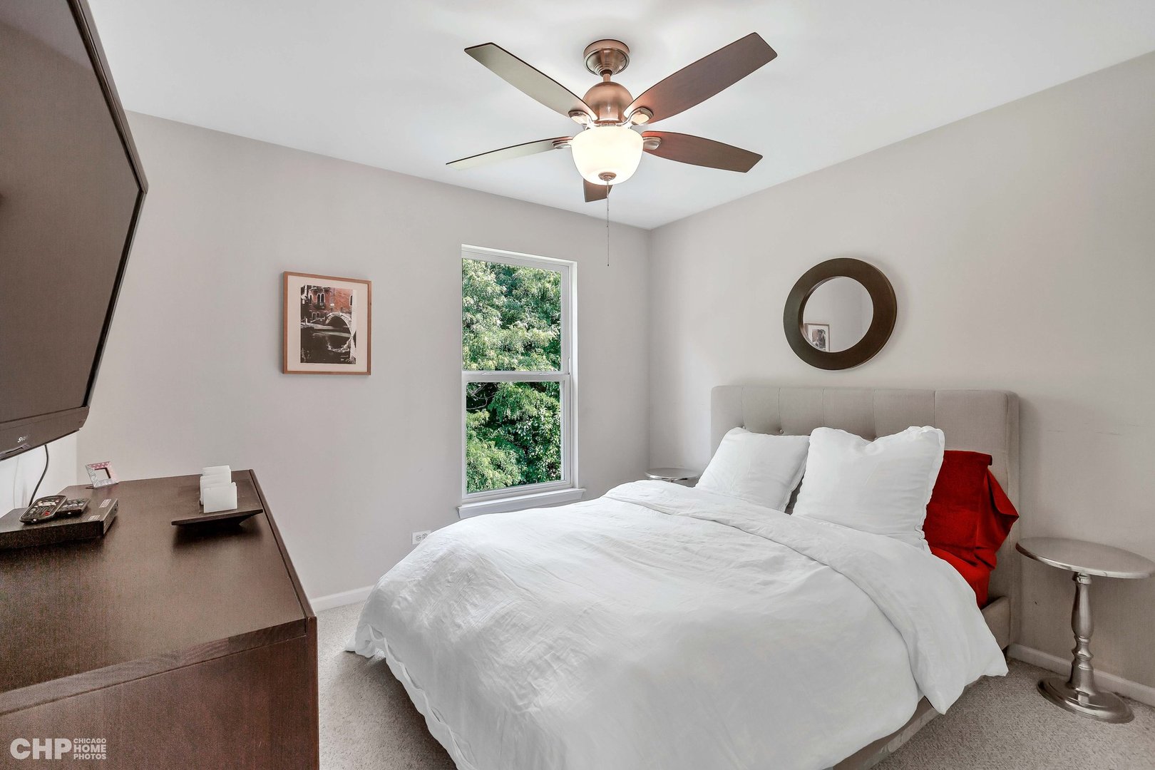 917 Blue Ridge Drive Streamwood, IL 60107 - Photo 23 of 46 a bedroom with a bed and a chandelier