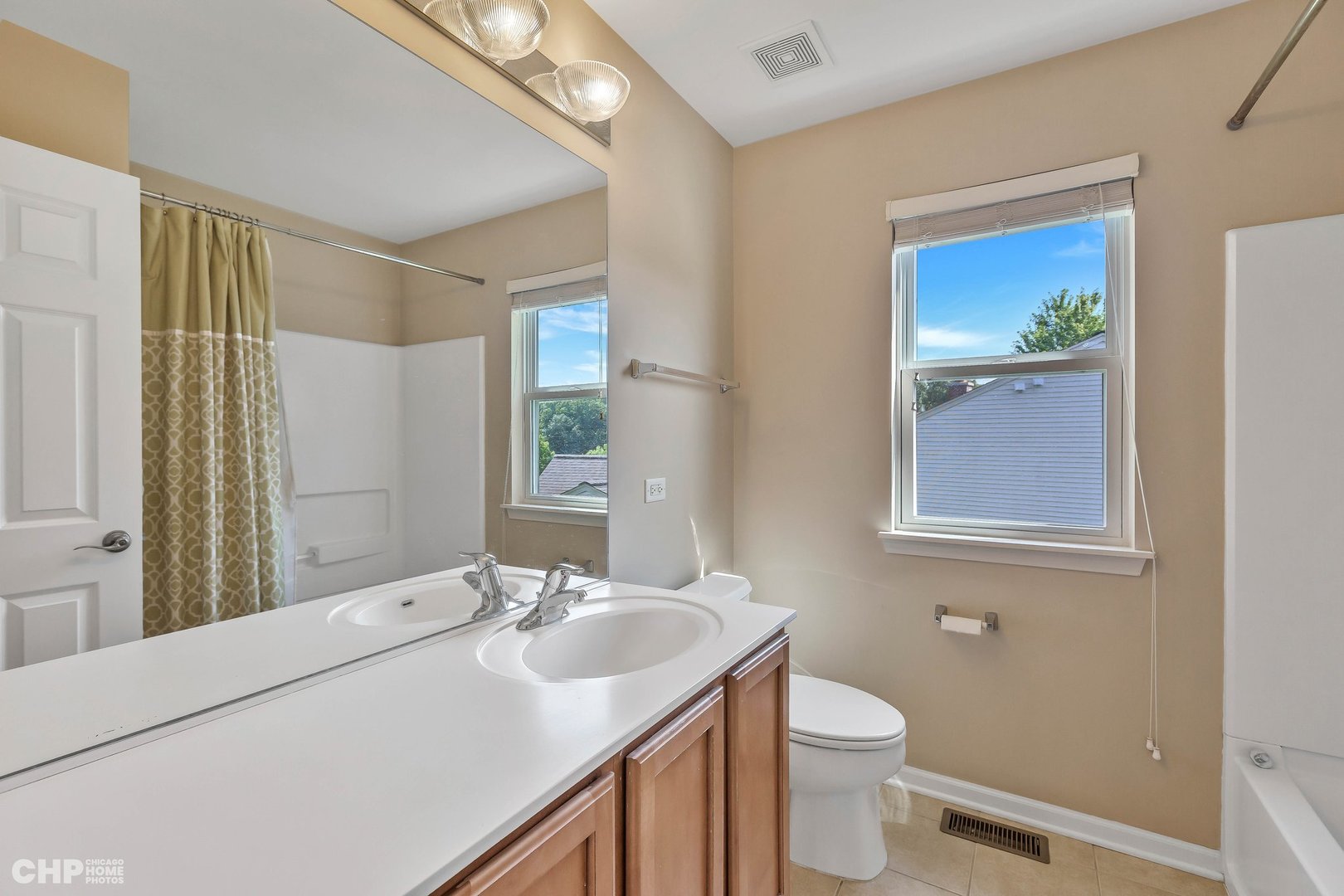 917 Blue Ridge Drive Streamwood, IL 60107 - Photo 24 of 46 a bathroom with a sink and a mirror