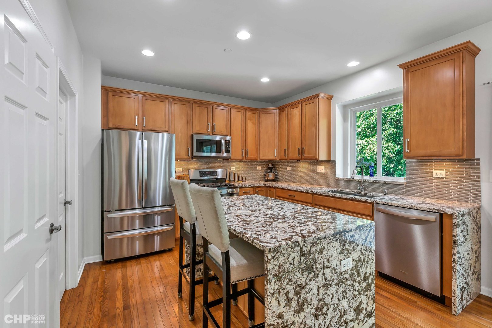 917 Blue Ridge Drive Streamwood, IL 60107 - Photo 8 of 46 a kitchen with stainless steel appliances granite countertop a refrigerator sink and microwave