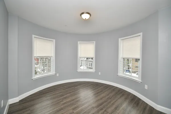 a view of an empty room with windows